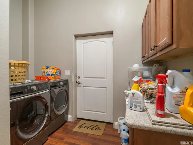 a view of a patio with a table and chairs