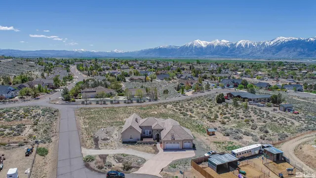 an aerial view of a house with a garden