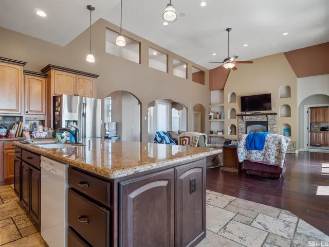 a kitchen with stainless steel appliances granite countertop a lot of counter space