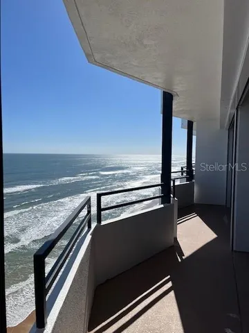 a bedroom with a bed and a large mirror