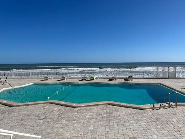 a view of a swimming pool and an outdoor space