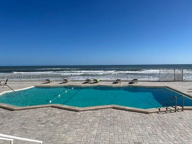 a view of a swimming pool and an outdoor space
