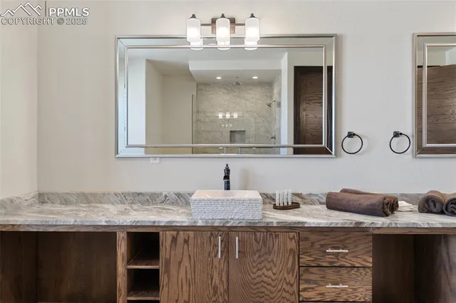 a bathroom with double sink and a mirror