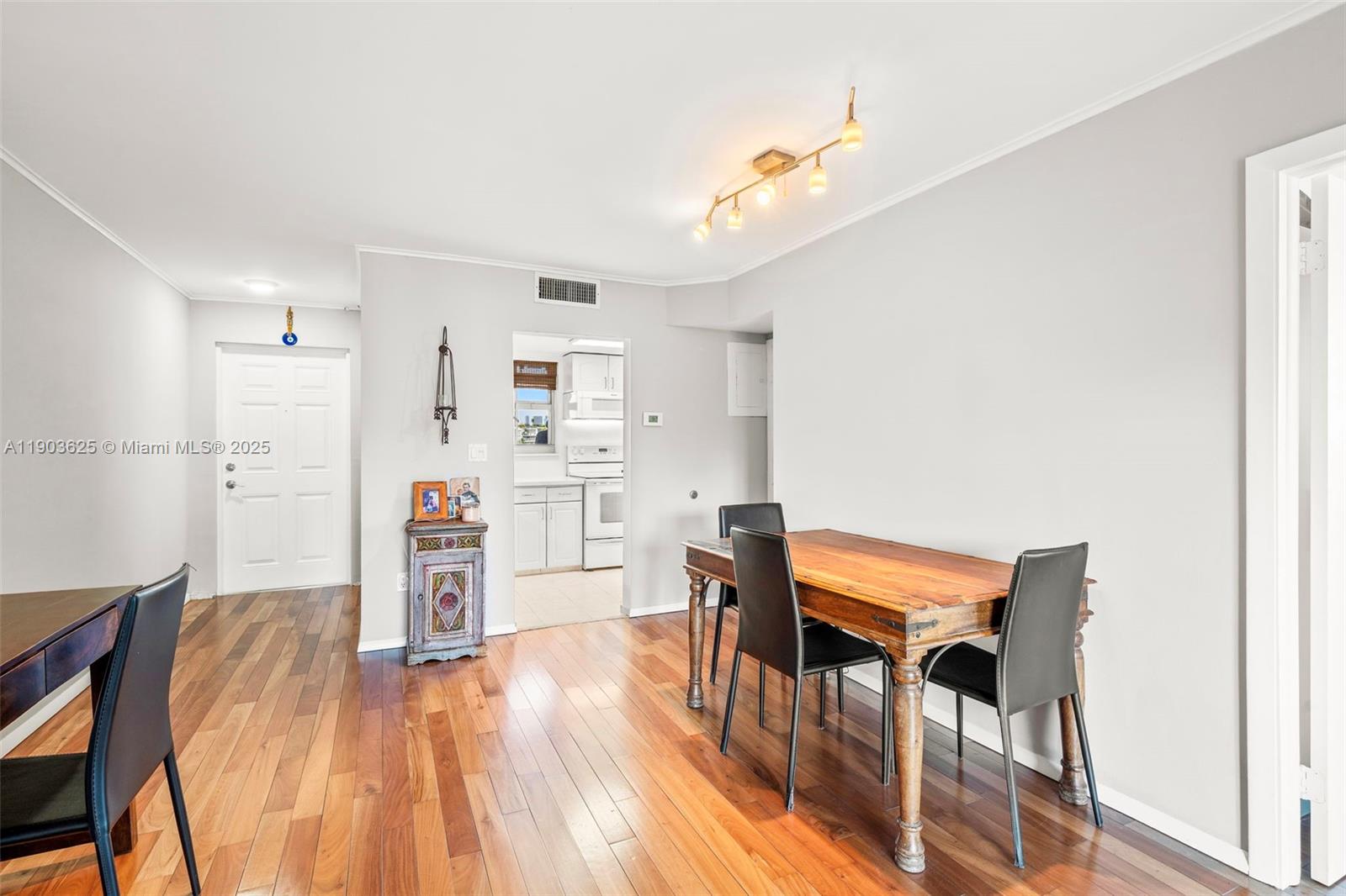 1674 Bay Road, Unit 401 Miami Beach, FL 33139 - Photo 6 of 33 a room with furniture and wooden floor