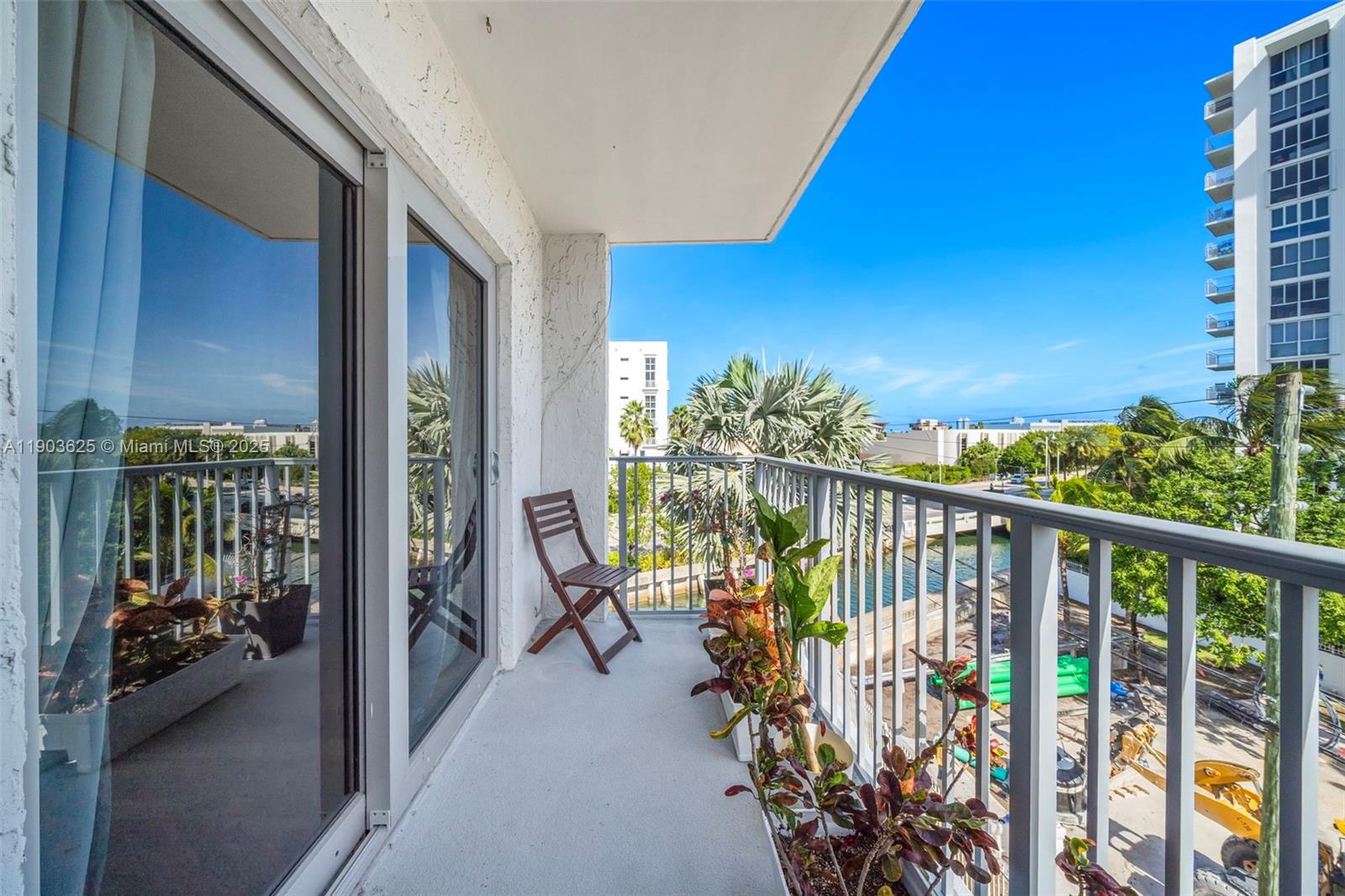 1674 Bay Road, Unit 401 Miami Beach, FL 33139 - Photo 7 of 33 a balcony with furniture and garden view