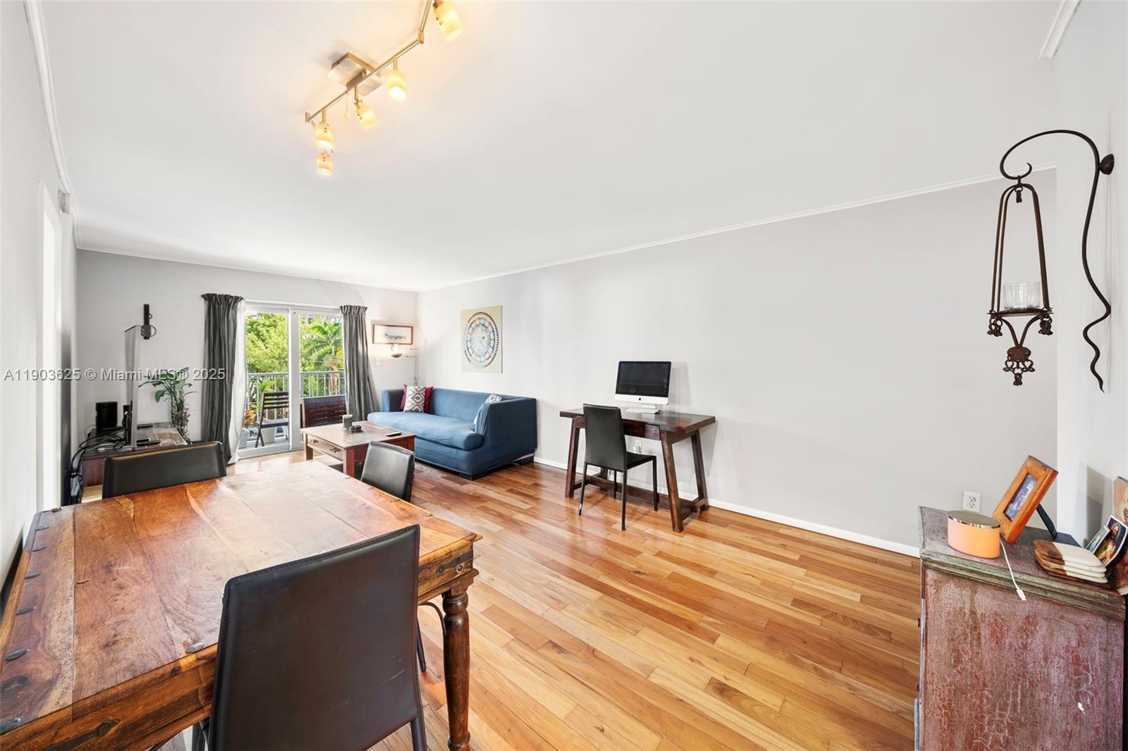 1674 Bay Road, Unit 401 Miami Beach, FL 33139 - Photo 9 of 33 a living room with furniture and a table
