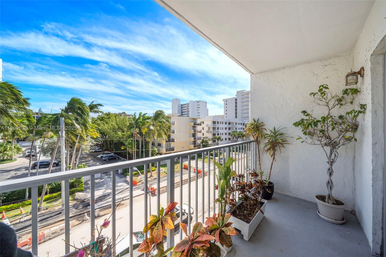 1674 Bay Road, Unit 401 Miami Beach, FL 33139 - Photo 10 of 33 a view of a balcony with chairs