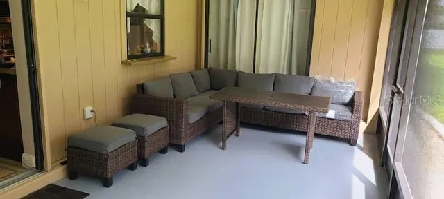 a living room with furniture and a window