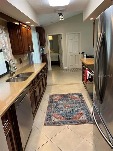 a bathroom with a sink a mirror and a shower