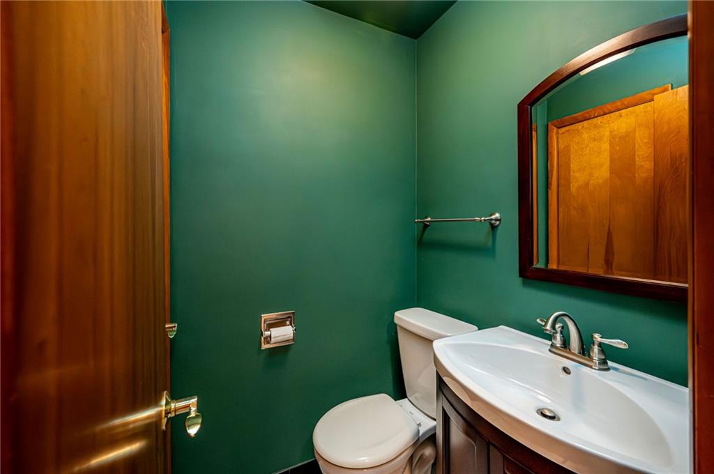 128 Reservoir Hill Road Uniontown, PA 15401 - Photo 15 of 30 a bathroom with a sink a toilet and mirror