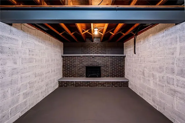 a view of empty room with a fireplace