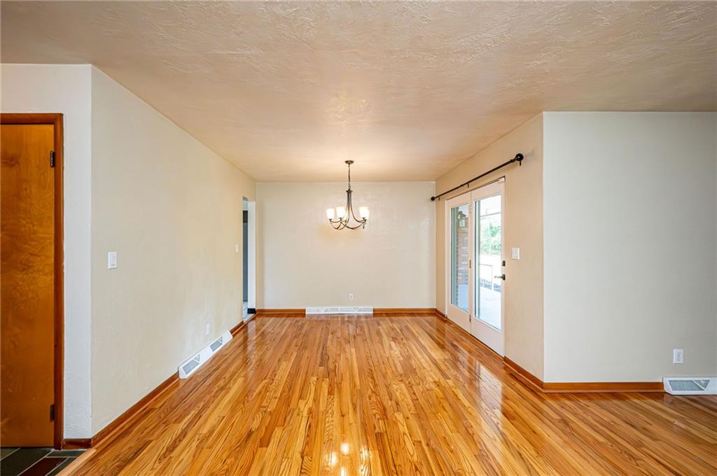 128 Reservoir Hill Road Uniontown, PA 15401 - Photo 5 of 30 a view of empty room with wooden floor and fan