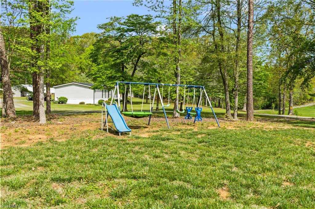 311 Reynolds Road Lexington, NC 27292 - Photo 27 of 32 Additional lot across road adjacent to storage bldg for parking, playing, etc.