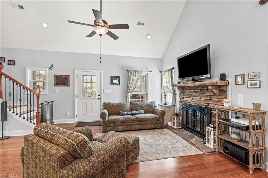 ML Living Room area with fireplace & adjacent to Screen Porch & Deck