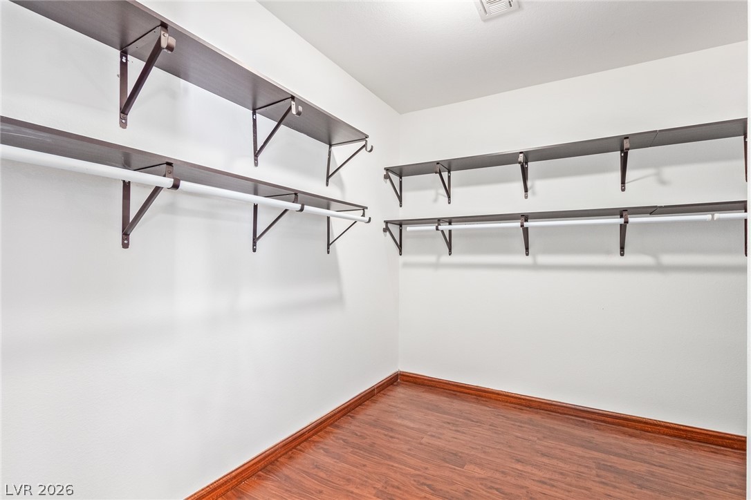 1477 Rancho Ridge Drive Henderson, NV 89012 - Photo 23 of 46 Streamlined organization awaits in this ample walk-in closet, featuring sturdy shelving and hanging rods.