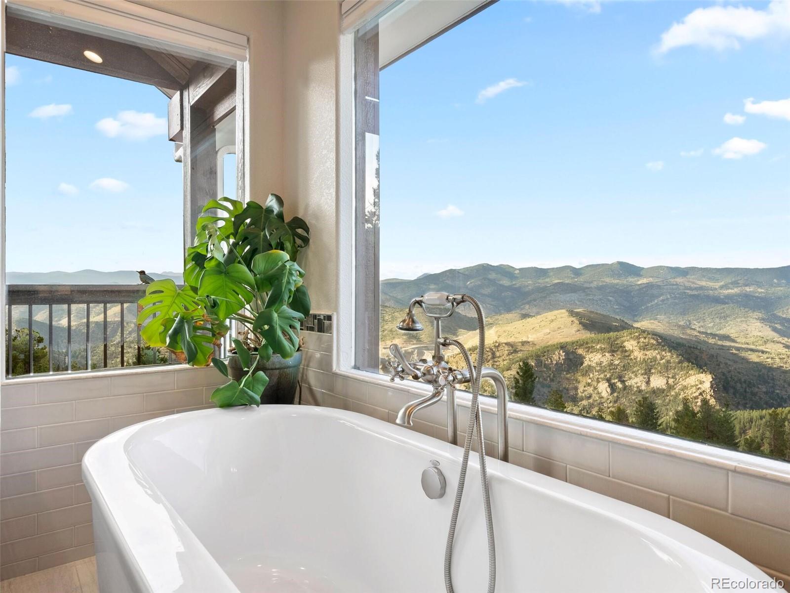913 Saddle Ridge Drive Evergreen, CO 80439 - Photo 32 of 50 a view of a balcony with furniture