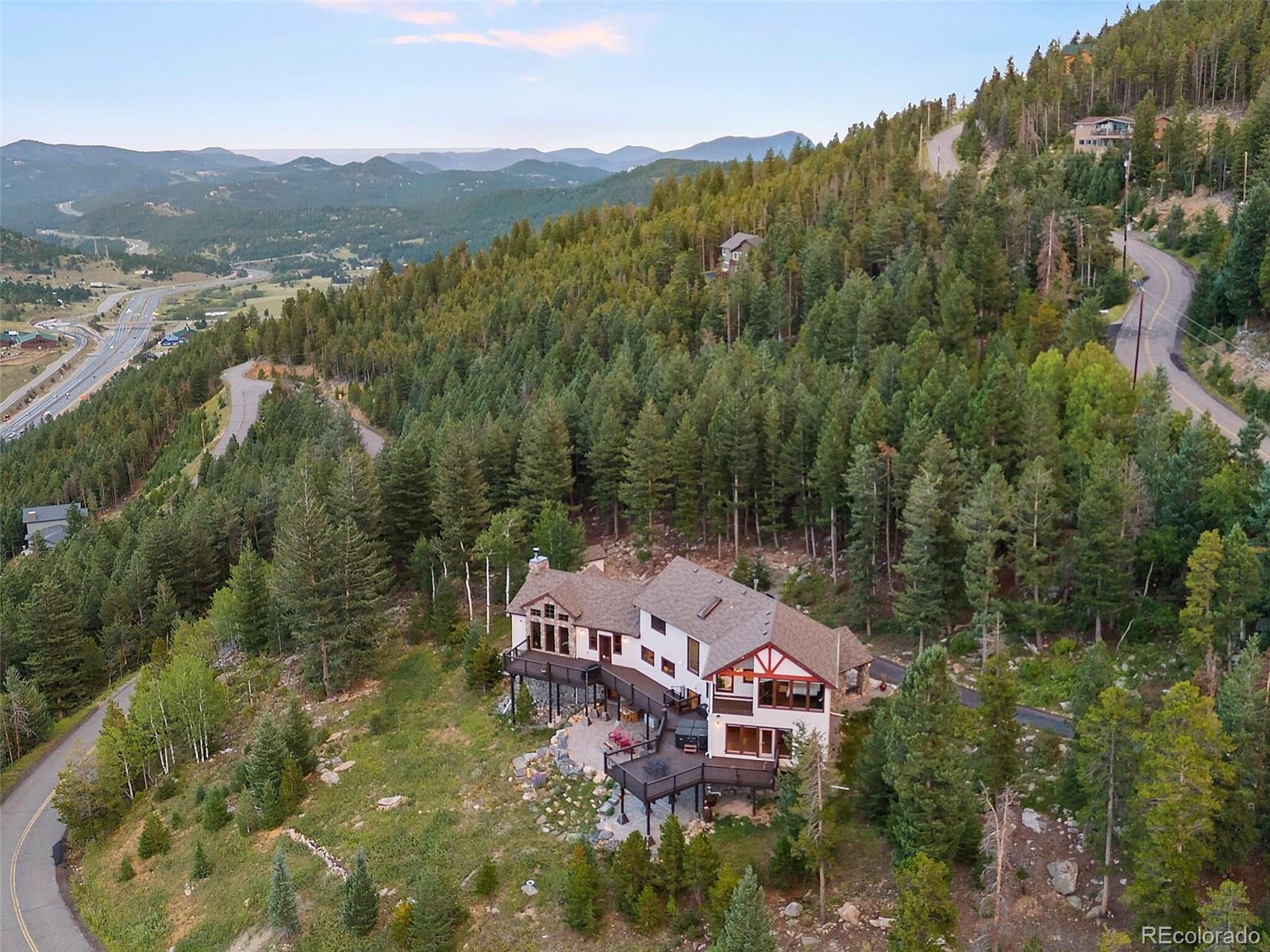 913 Saddle Ridge Drive Evergreen, CO 80439 - Photo 47 of 50 an aerial view of a house with a garden