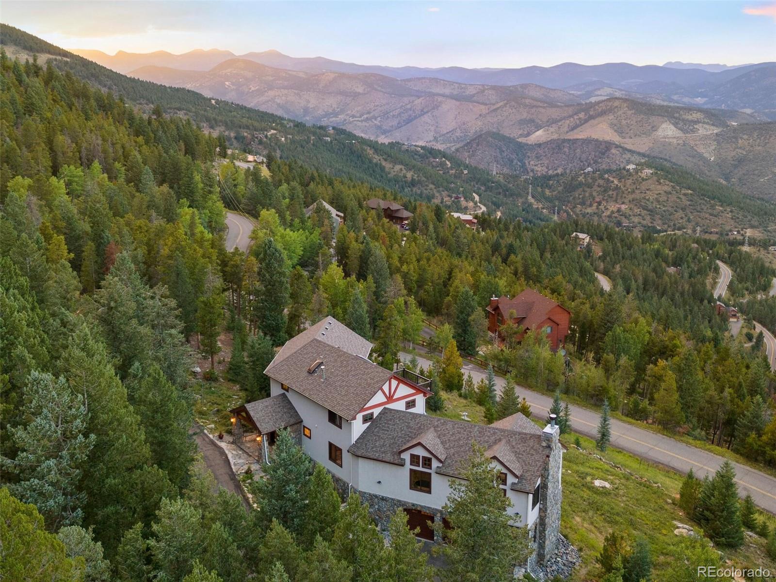 913 Saddle Ridge Drive Evergreen, CO 80439 - Photo 50 of 50 an aerial view of a house with mountain view