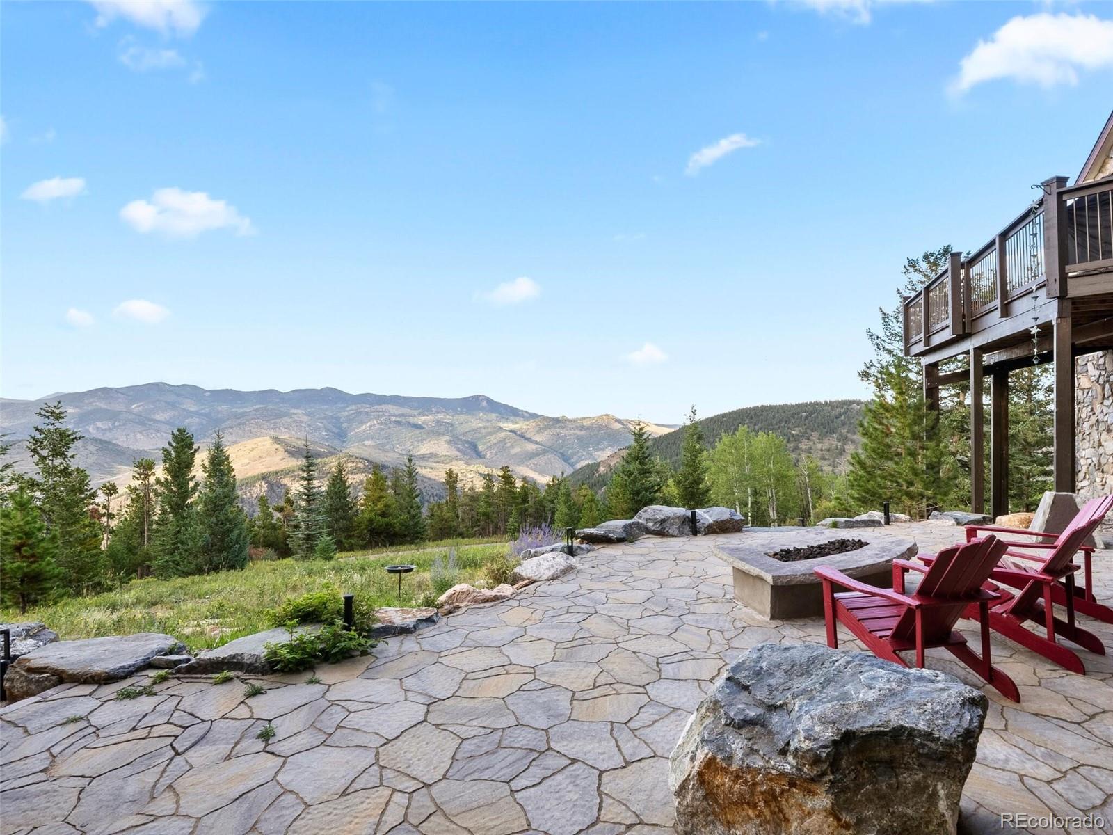 913 Saddle Ridge Drive Evergreen, CO 80439 - Photo 6 of 50 a view of a terrace with sitting area