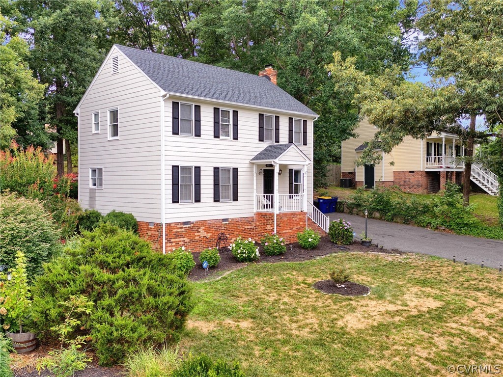 10912 Rufford Road Chester, VA 23831 - Photo 3 of 48 a front view of a house with a yard