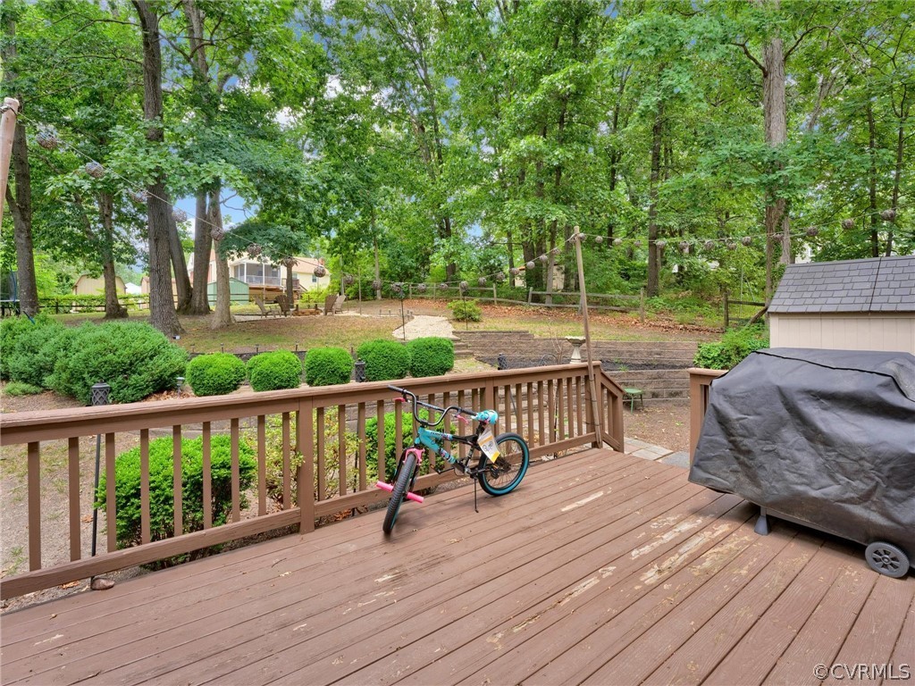 10912 Rufford Road Chester, VA 23831 - Photo 36 of 48 a view of a wooden deck with a bench