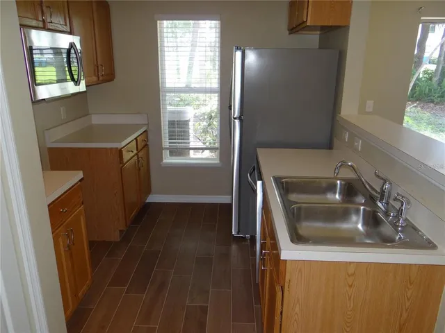 a kitchen that has a sink and a window