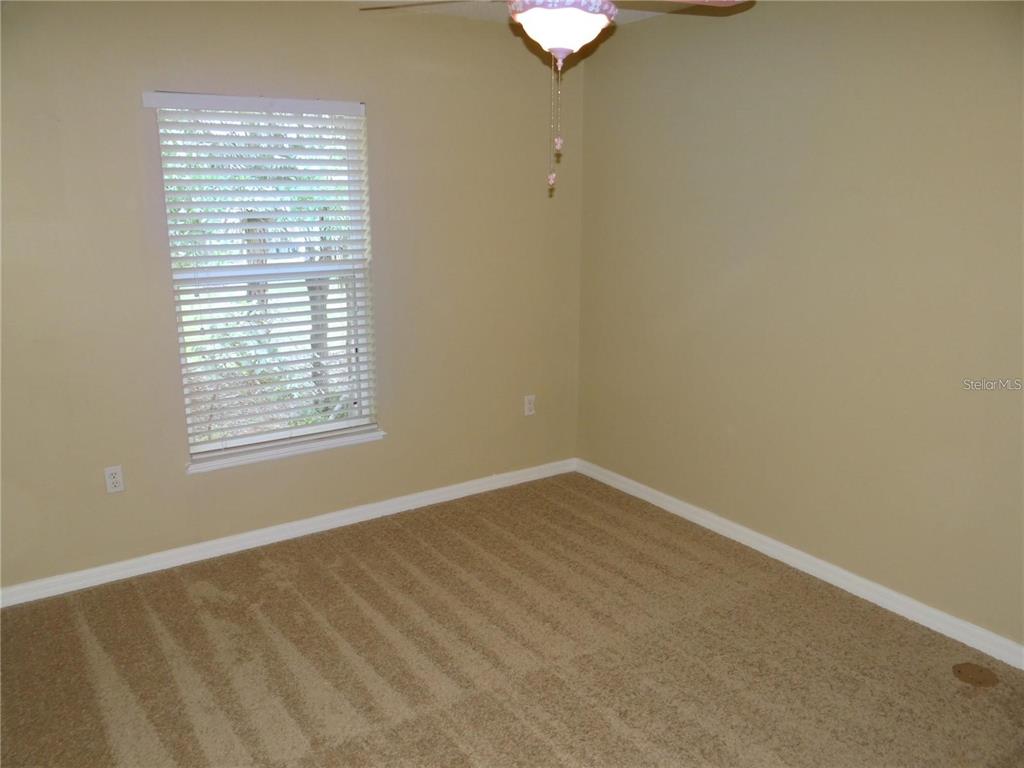 4654 Ashburn Square Drive Tampa, FL 33610 - Photo 6 of 11 an empty room with a window