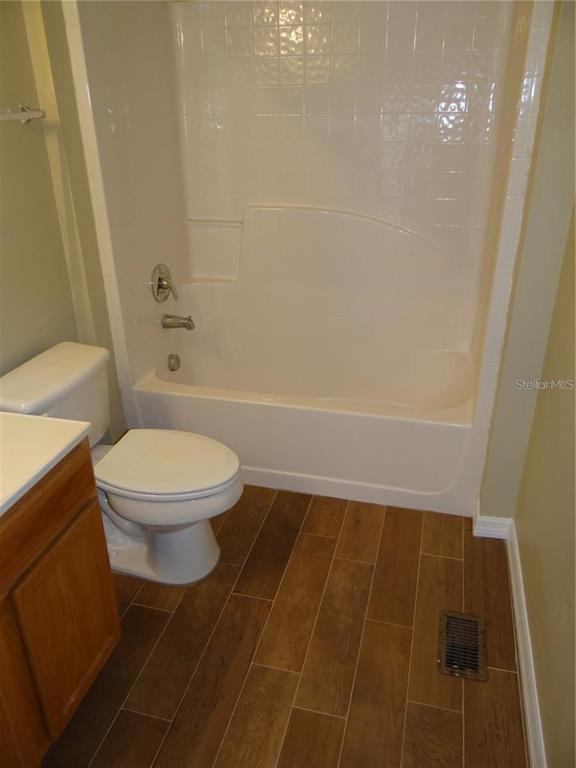 4654 Ashburn Square Drive Tampa, FL 33610 - Photo 10 of 11 a bathroom with a toilet and a shower