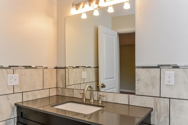 100 Mendon Road North Smithfield, RI 02896 - Photo 17 of 22 a bathroom with a sink and mirror