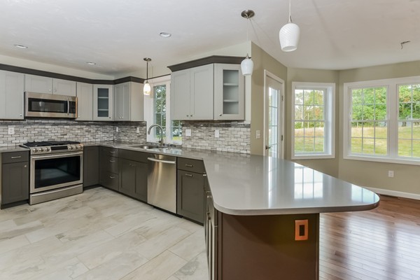 100 Mendon Road North Smithfield, RI 02896 - Photo 7 of 22 a kitchen with stainless steel appliances granite countertop a stove a sink and a refrigerator