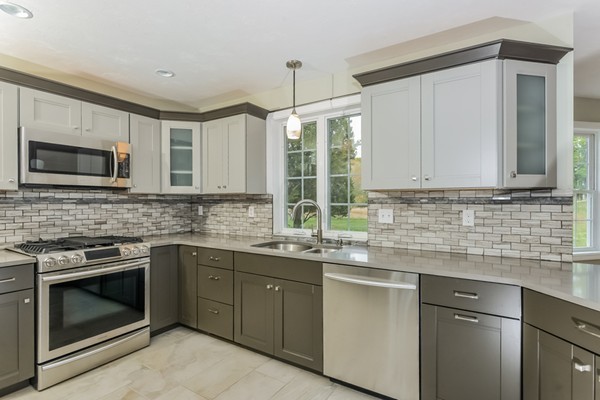 100 Mendon Road North Smithfield, RI 02896 - Photo 9 of 22 a kitchen with stainless steel appliances granite countertop a sink a stove and microwave