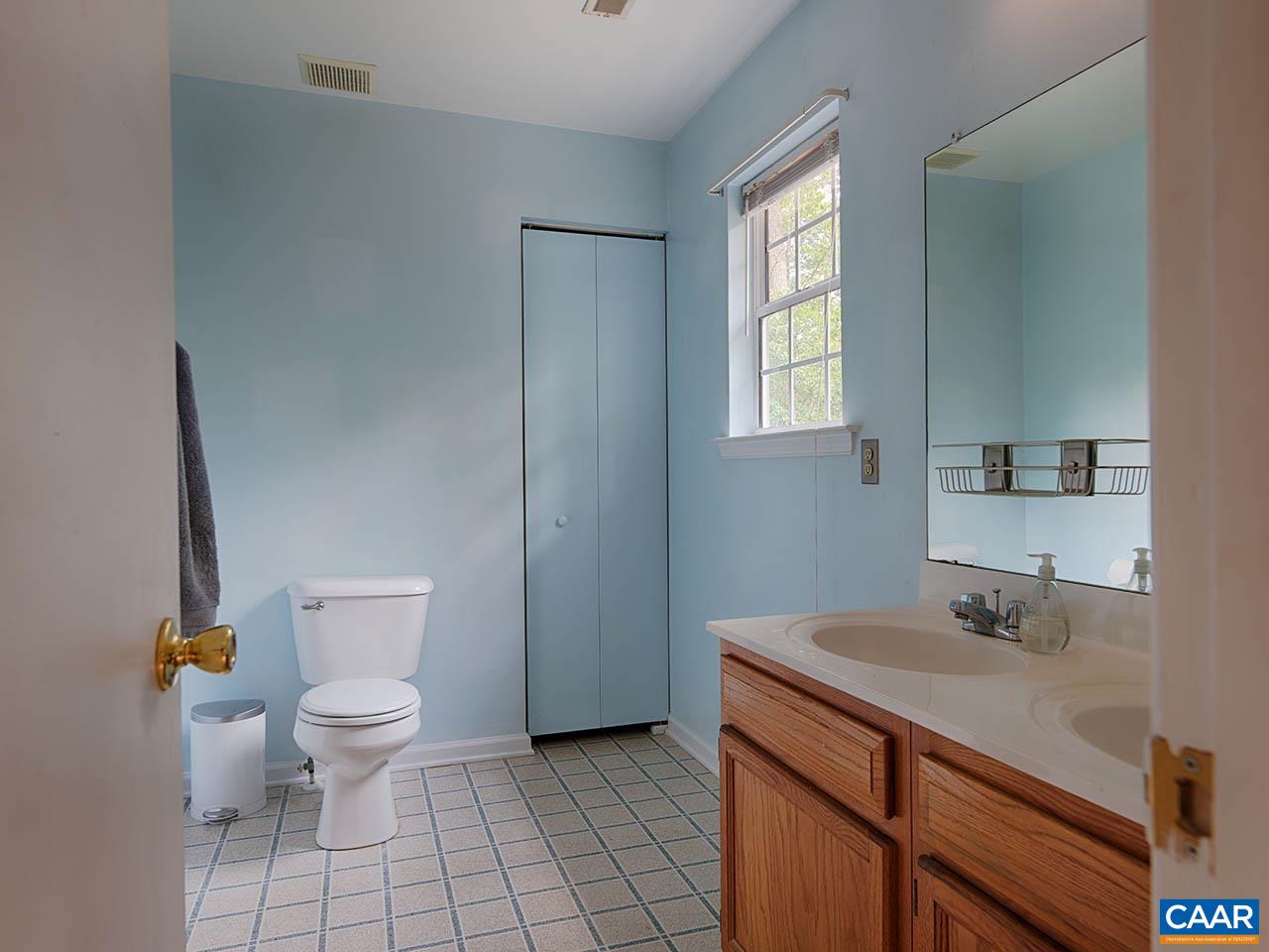 2115 Swift Run Road Ruckersville, VA 22968 - Photo 14 of 21 a bathroom with a sink toilet and window