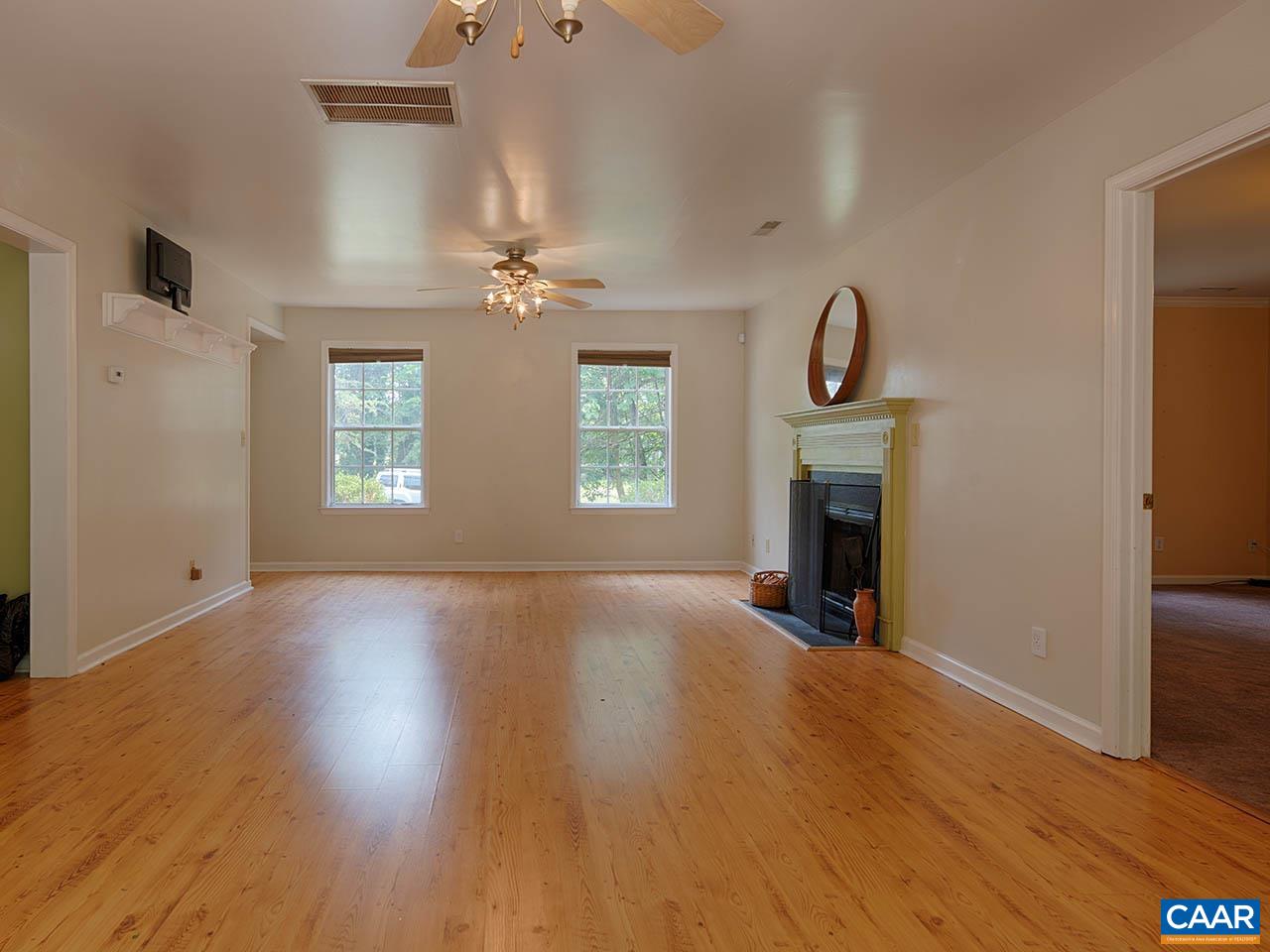 2115 Swift Run Road Ruckersville, VA 22968 - Photo 3 of 21 an empty room with windows and a fireplace