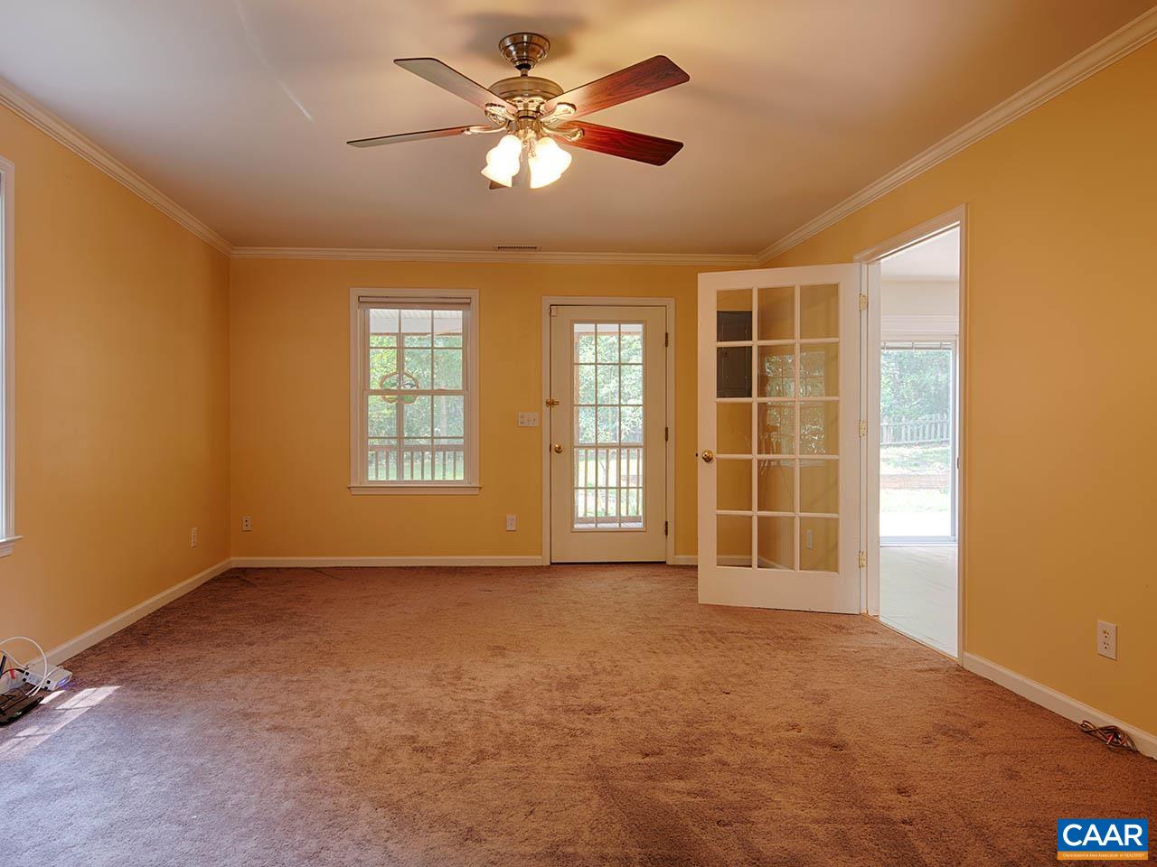 2115 Swift Run Road Ruckersville, VA 22968 - Photo 5 of 21 an empty room with windows and ceiling fan