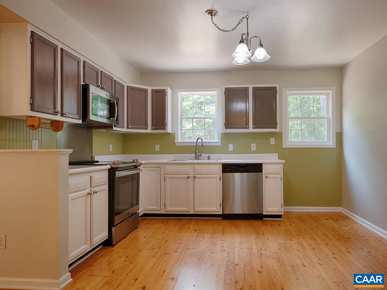 2115 Swift Run Road Ruckersville, VA 22968 - Photo 8 of 21 a kitchen with stainless steel appliances granite countertop a sink and stove top oven