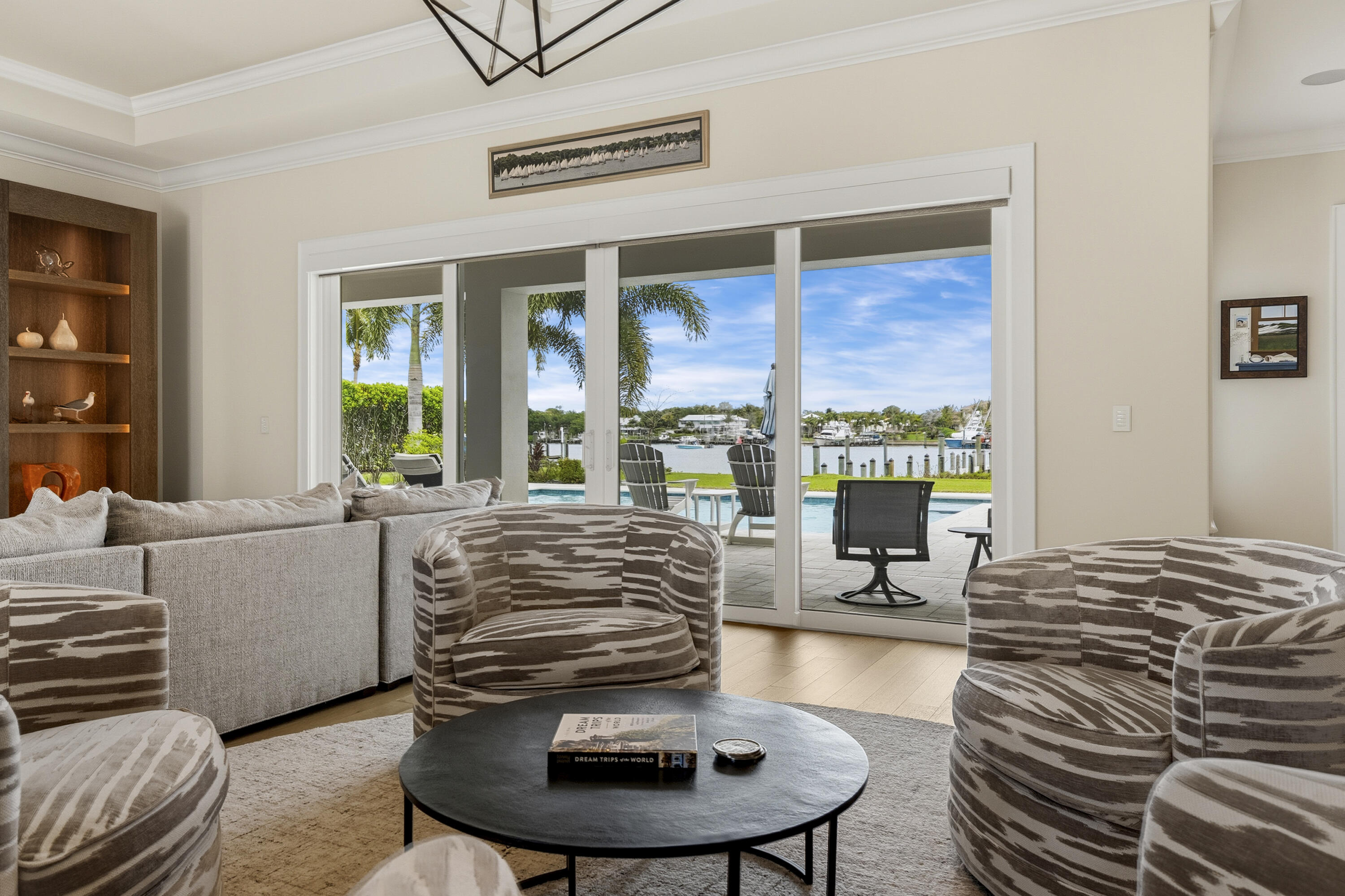 3973 Southeast Topsail Court Stuart, FL 34997 - Photo 29 of 38 a living room with furniture and a floor to ceiling window
