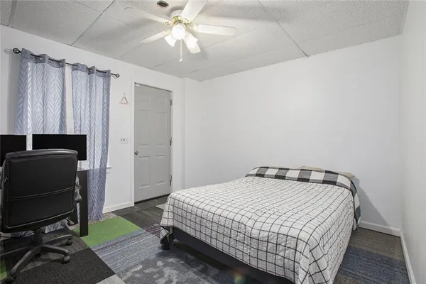a room with furniture and wooden floor