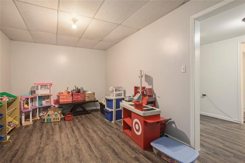 2482 Windchase Court Buford, GA 30518 - Photo 21 of 33 a room with furniture and wooden floor