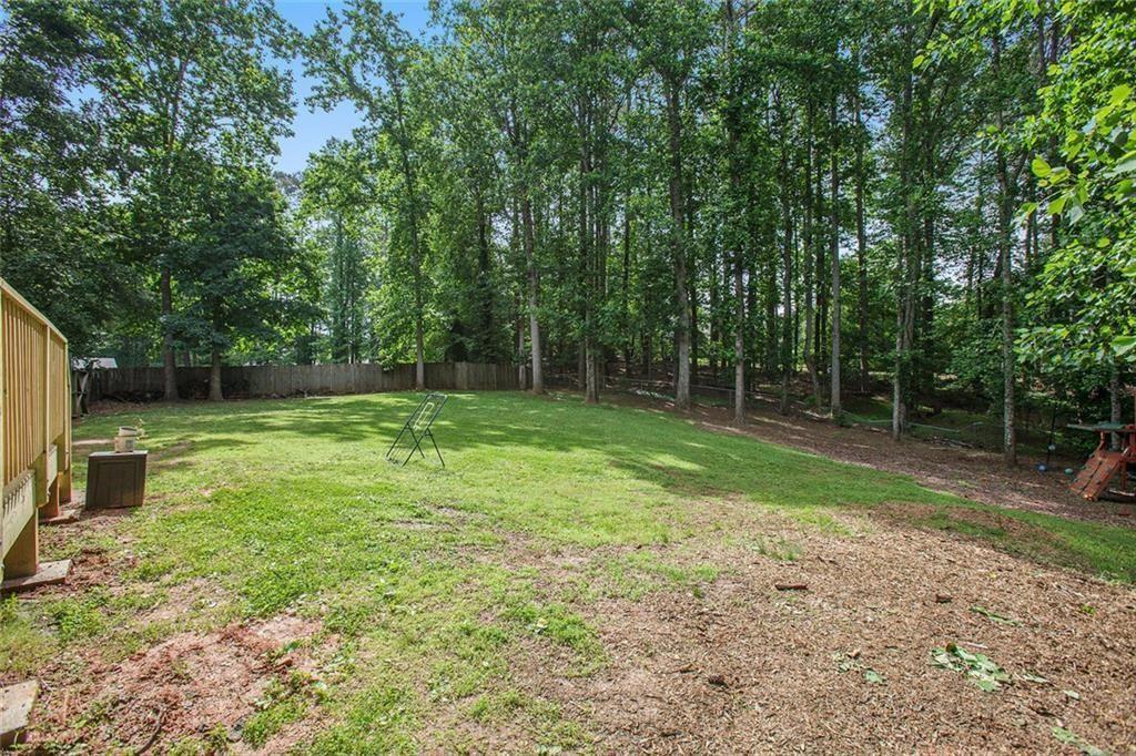2482 Windchase Court Buford, GA 30518 - Photo 25 of 33 a backyard of a house with trampoline