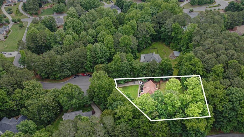 2482 Windchase Court Buford, GA 30518 - Photo 33 of 33 an aerial view of residential houses with outdoor space and trees