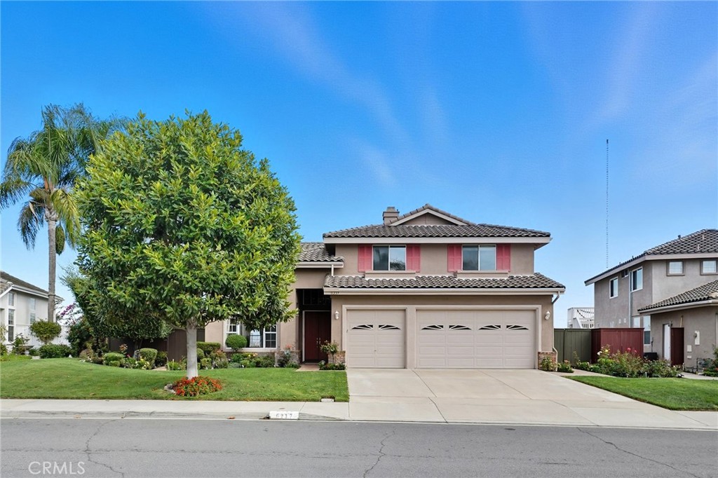 5217 Palmera Drive Oceanside, CA 92056 - Photo 1 of 4 a front view of a house with a yard and garage