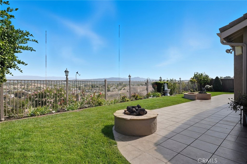 5217 Palmera Drive Oceanside, CA 92056 - Photo 3 of 4 a view of a backyard with potted plants