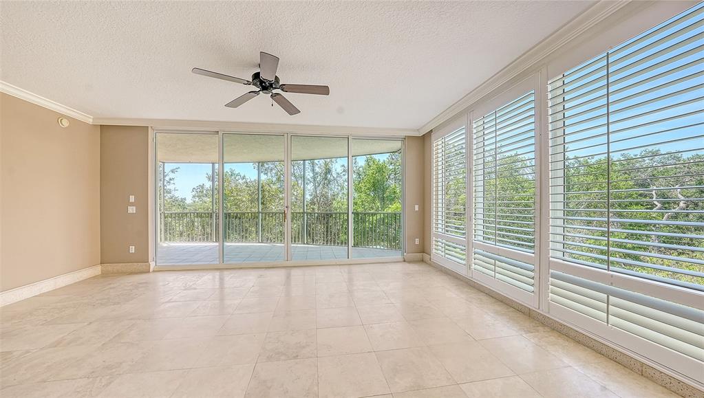 401 North Point Road, Unit 301 Osprey, FL 34229 - Photo 11 of 91 a view of an empty room with a window