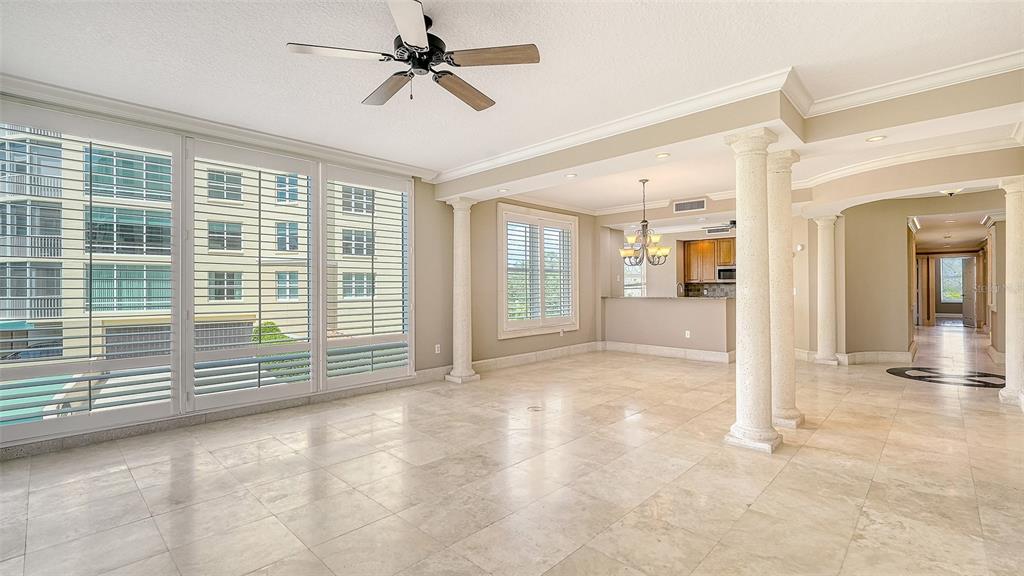 401 North Point Road, Unit 301 Osprey, FL 34229 - Photo 14 of 91 a view of empty room with wooden floor and fan