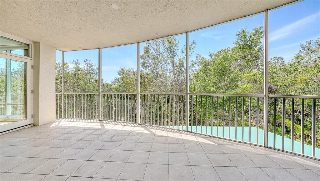 401 North Point Road, Unit 301 Osprey, FL 34229 - Photo 17 of 91 a view of a garden from a windows