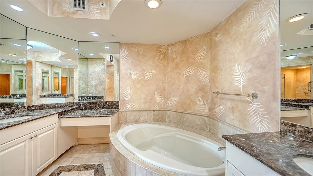 401 North Point Road, Unit 301 Osprey, FL 34229 - Photo 28 of 91 a bathroom with a granite countertop sink and a mirror