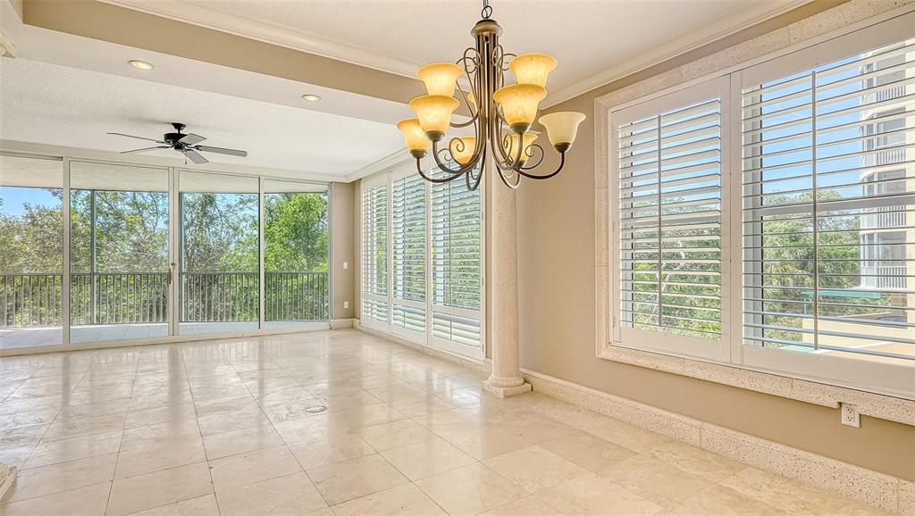 401 North Point Road, Unit 301 Osprey, FL 34229 - Photo 10 of 91 a view of a room with window and a ceiling fan