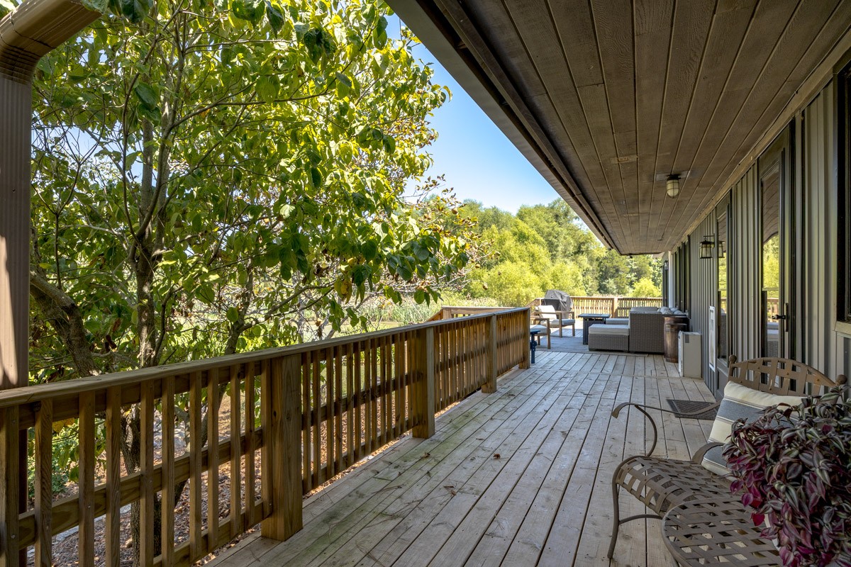 6923 Cross Keys Road College Grove, TN 37046 - Photo 25 of 67 a view of balcony with chairs and wooden fence