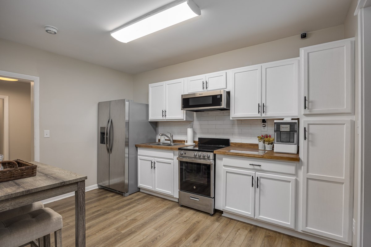 6923 Cross Keys Road College Grove, TN 37046 - Photo 41 of 67 a kitchen with white cabinets and white appliances