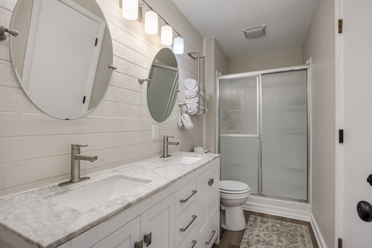 6923 Cross Keys Road College Grove, TN 37046 - Photo 50 of 67 a bathroom with a granite countertop sink a toilet and shower